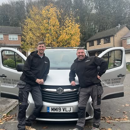 Two workers with company van