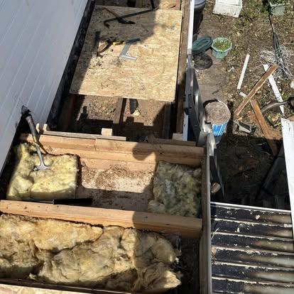 Roof being stripped showing insulation