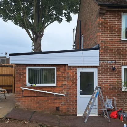 Completed EPDM flat roof and white fascia wider view