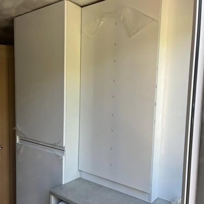 Fitted white wardrobe and storage unit