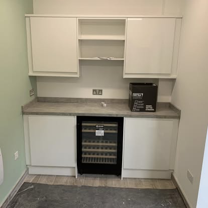 Built-in white kitchen with wine cooler