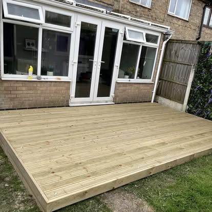 Timber garden decking with French doors
