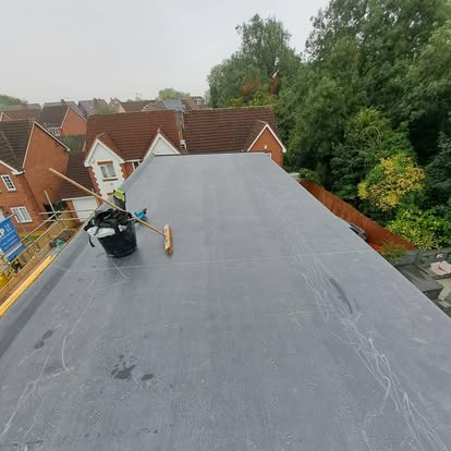 EPDM membrane being applied on flat roof
