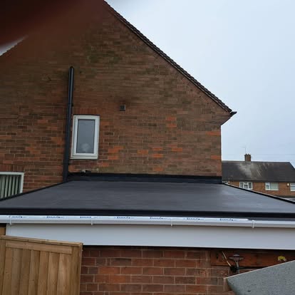 Completed EPDM extension roof brick house