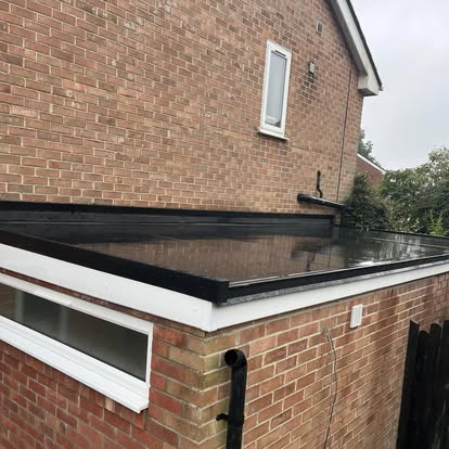 Completed EPDM flat roof on brick extension