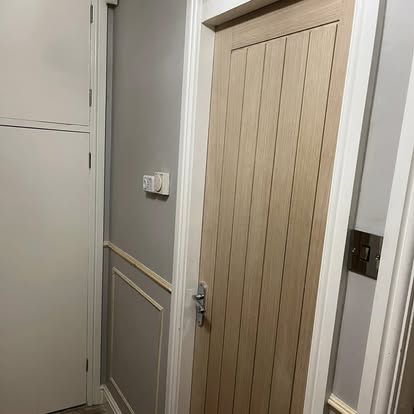 Oak internal door with hallway panelling