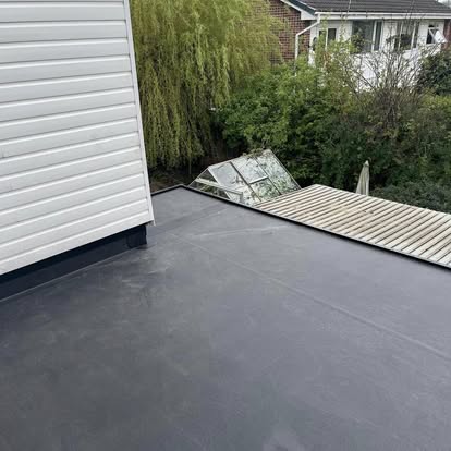 EPDM flat roof with white weatherboard cladding