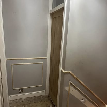 Hallway oak door and wall panelling