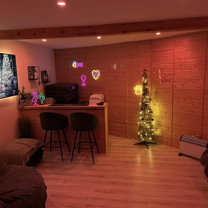 Garden room interior bar area with neon signs