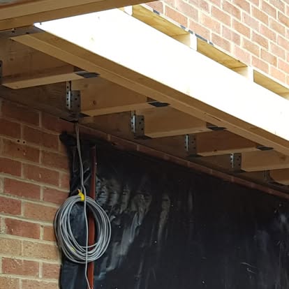 Lean-to roof timber frame on brick house