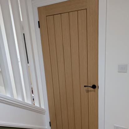 Oak internal door with black lever handle