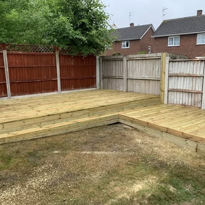 Completed L-shaped timber deck fills garden