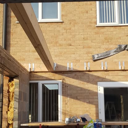 Extension roof structure timber joists sandy brick