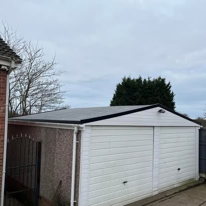 Completed EPDM on white prefab garage new fascia boards