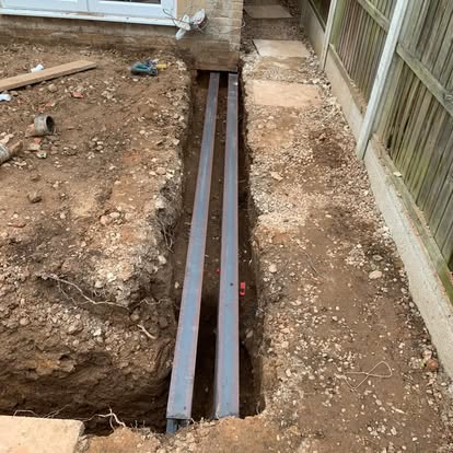 Foundation trench excavated with RSJ steel beams laid