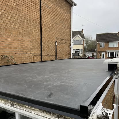 Completed EPDM flat roof on brick garage outbuilding