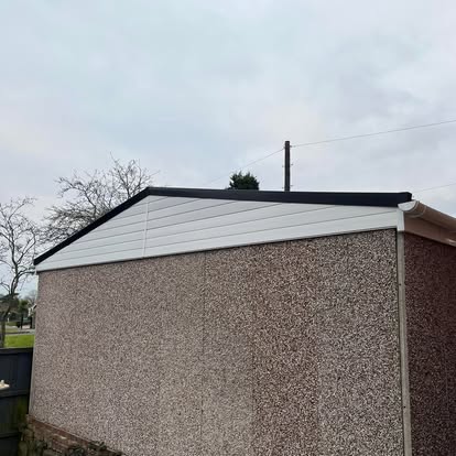 Completed EPDM garage roof side view with white fascia