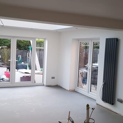 Extension interior plastered large glazed doors and windows