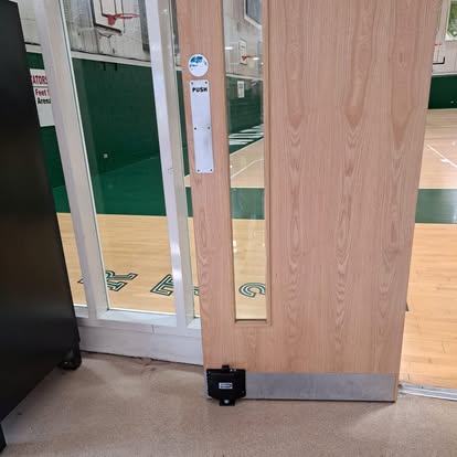 Oak door fitted inside commercial basketball arena
