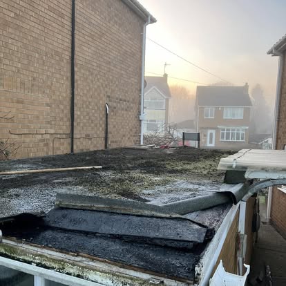 Old deteriorating flat roof before EPDM foggy morning