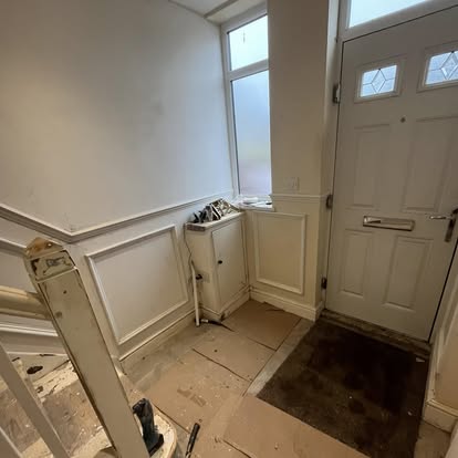 Hallway door and panelling during renovation