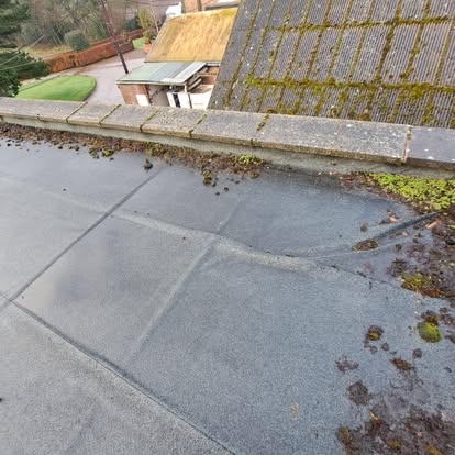 EPDM flat roof beside old tiled roof