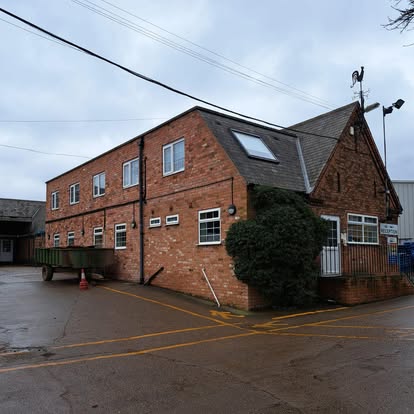 Commercial brick building exterior for roofing work