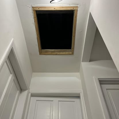 Loft hatch opening created with timber frame