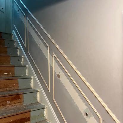 Staircase wall panelling in progress mid hallway