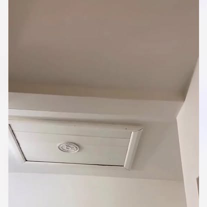 White painted loft hatch panel closed state