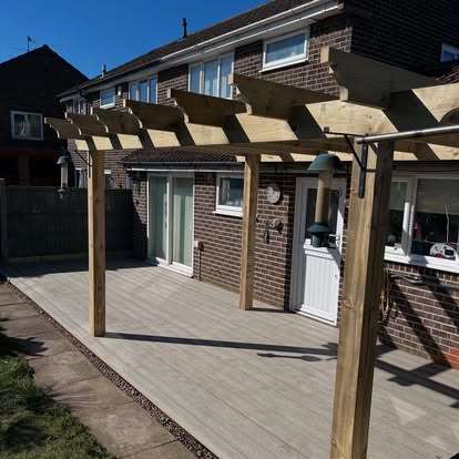 Semi-detached house before decking replacement old boards