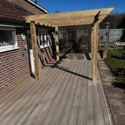 Completed composite decking with timber pergola side view