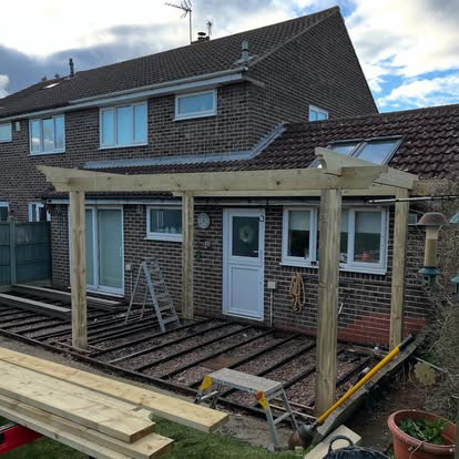 Composite decking frame being constructed with timber pergola