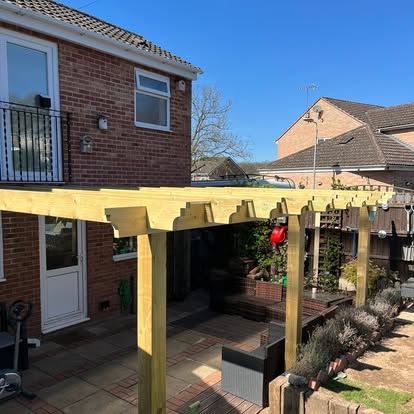 Timber pergola with polycarbonate roof completed