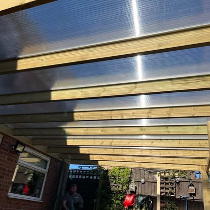 Clear polycarbonate pergola roof viewed from below