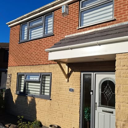 House 6 completed white soffit and timber entrance canopy