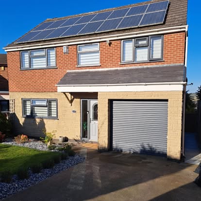 Dark composite decking with small pergola terrace house