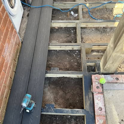 Dark composite decking joists subframe being laid
