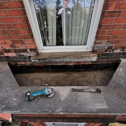 Bay window roof with EPDM being applied angle grinder visible