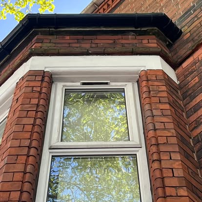 Victorian terrace bay window with white UPVC soffit surround