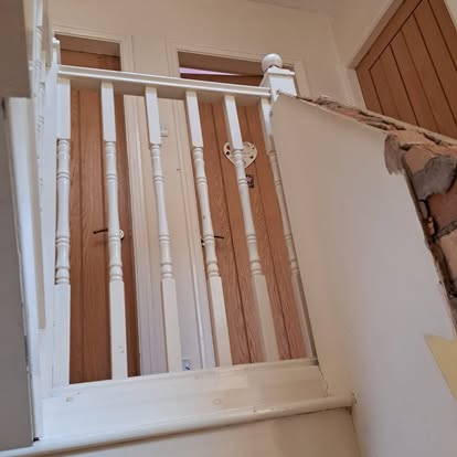 White painted staircase with turned spindles
