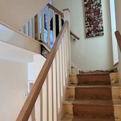 Staircase with square spindles and oak rail