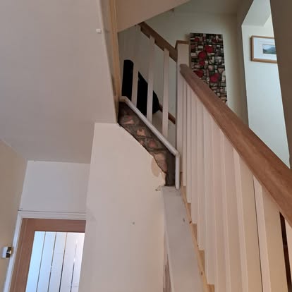 Staircase with square spindles and oak rail