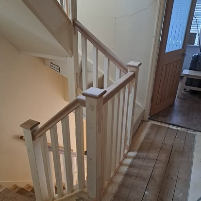 Square spindle staircase with oak handrail