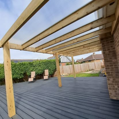 Grey composite deck with polycarbonate pergola