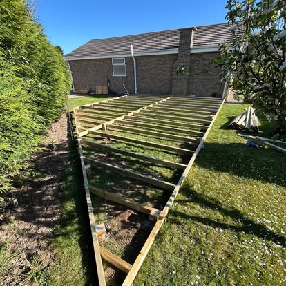 Composite deck subframe being installed at bungalow