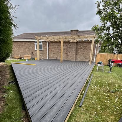 Composite deck and pergola frame being built