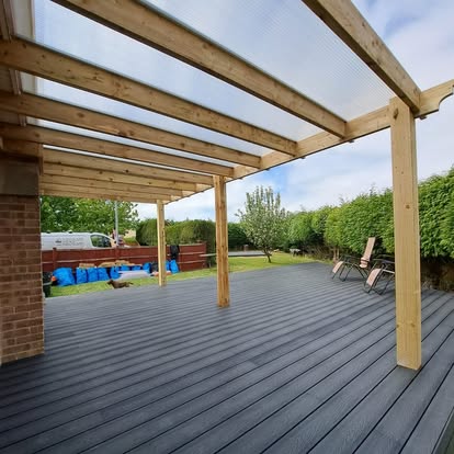 Completed composite deck under polycarbonate pergola