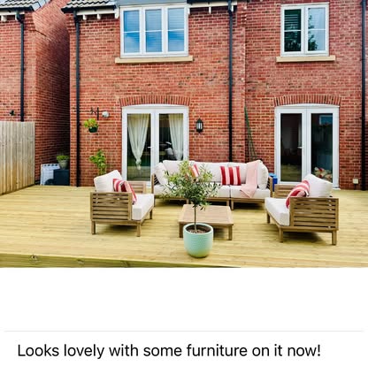 Large timber deck with outdoor sofa set at new build