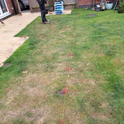 Garden marked with string lines for new build deck